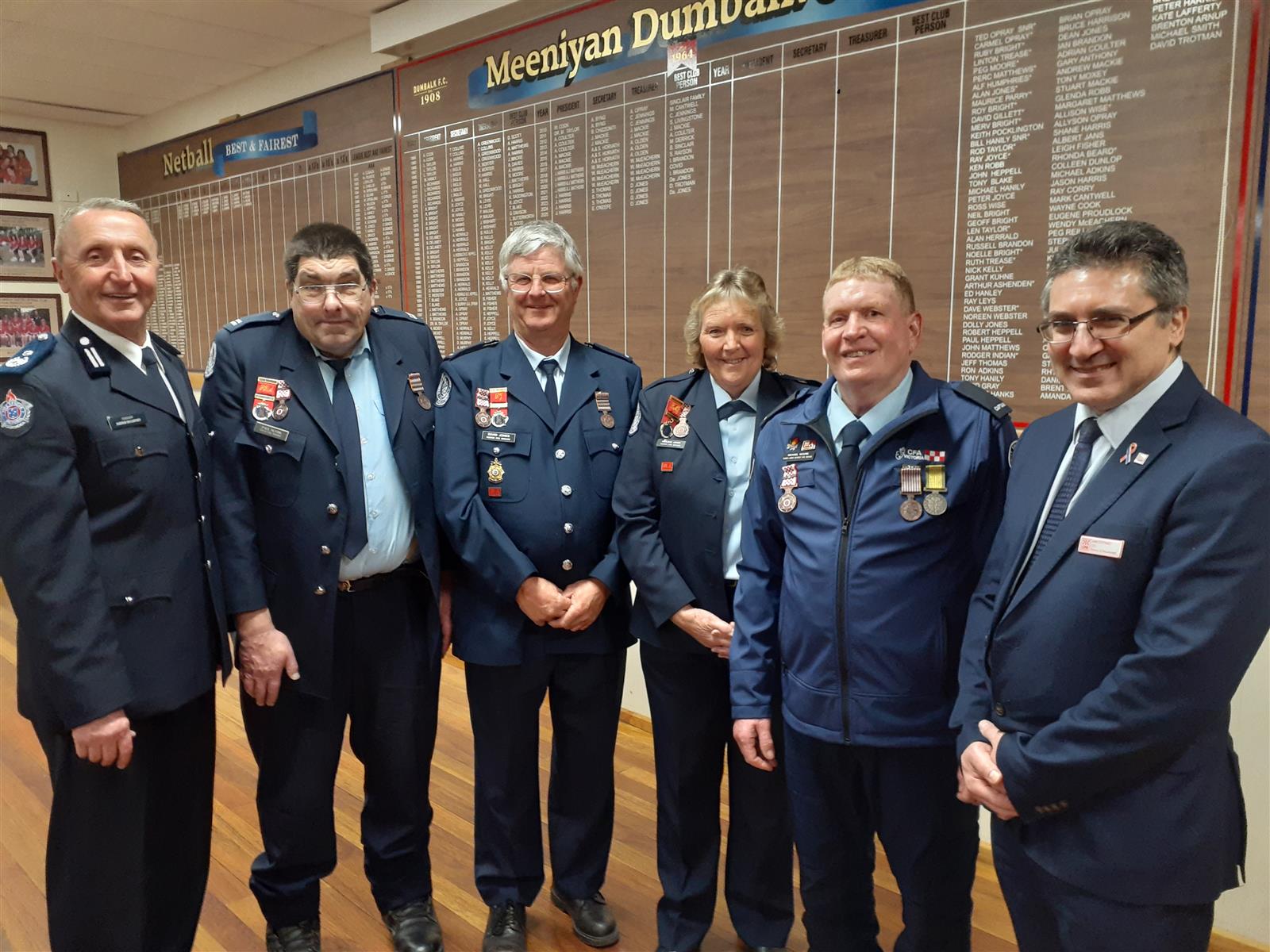 National Medal Recipients Paul Austin, David Jones, Kaylene Jones and Mick Moore, flanked by CFA presenters Commander Andrew McCartney (left), and Chief Financial Officer Sam Costanzo.